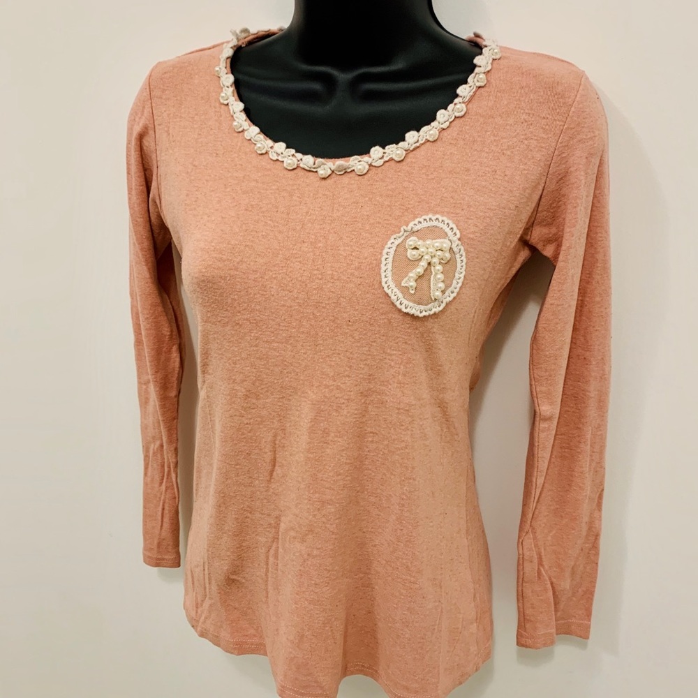 Pink pearl-neckline shirt